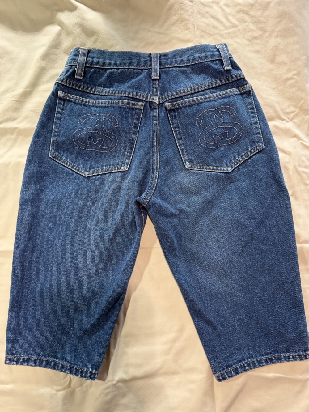 Stüssy blue denim jeans with embroidered logo on back pockets